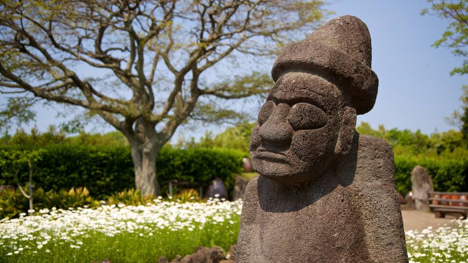 Jeju Folk Village Museum which includes a statue or sculpture, wildflowers and heritage elements