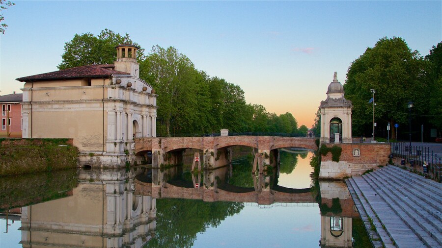 Porta Ognissanti featuring a bridge, a sunset and a river or creek