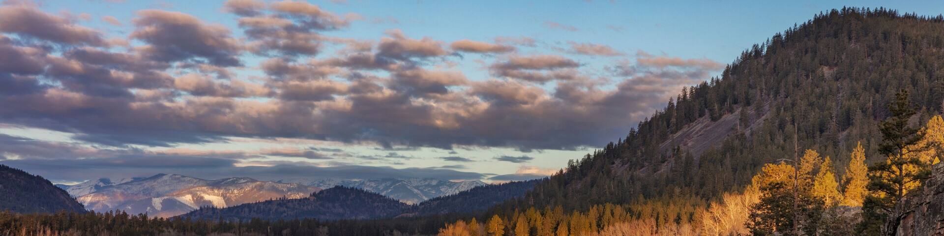 Sunrise clouds above Rainbow Lake near Plains, Montana, USA