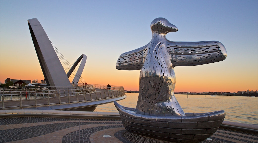 Elizabeth Quay which includes a sunset, outdoor art and general coastal views