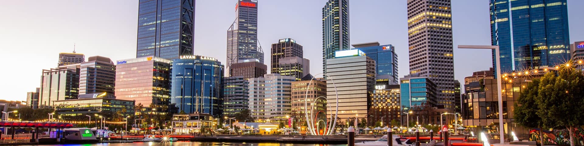 Elizabeth Quay which includes a sunset, a city and a bay or harbor