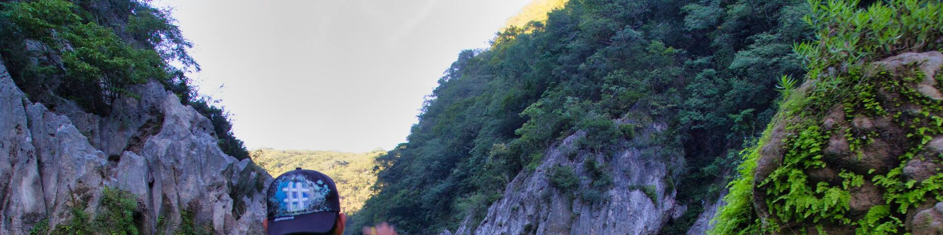 San Luis Potosí Mexico, 06/21/2020: man on his raft in an amazing morning scene at the waterfall (EL SALTO-EL MECO) San Luis Potosi Mexico, colorful sunrise. Beauty of nature concept background.