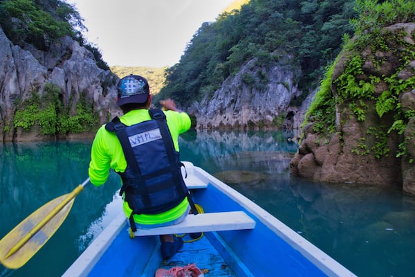 San Luis Potosí Mexico, 06/21/2020: man on his raft in an amazing morning scene at the waterfall (EL SALTO-EL MECO) San Luis Potosi Mexico, colorful sunrise. Beauty of nature concept background.