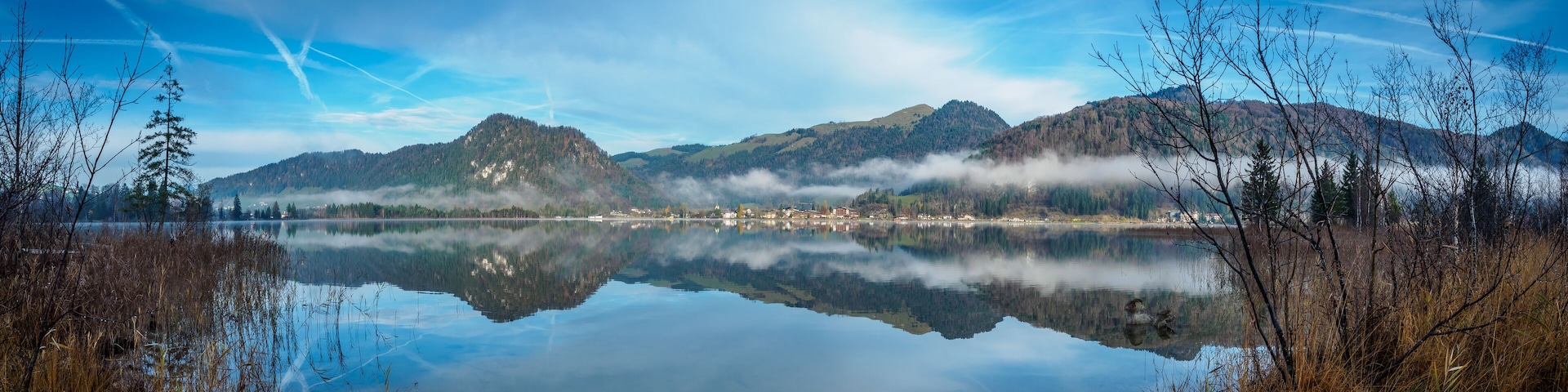 Panorama of Walchsee in Tyrol with reflection in the lake