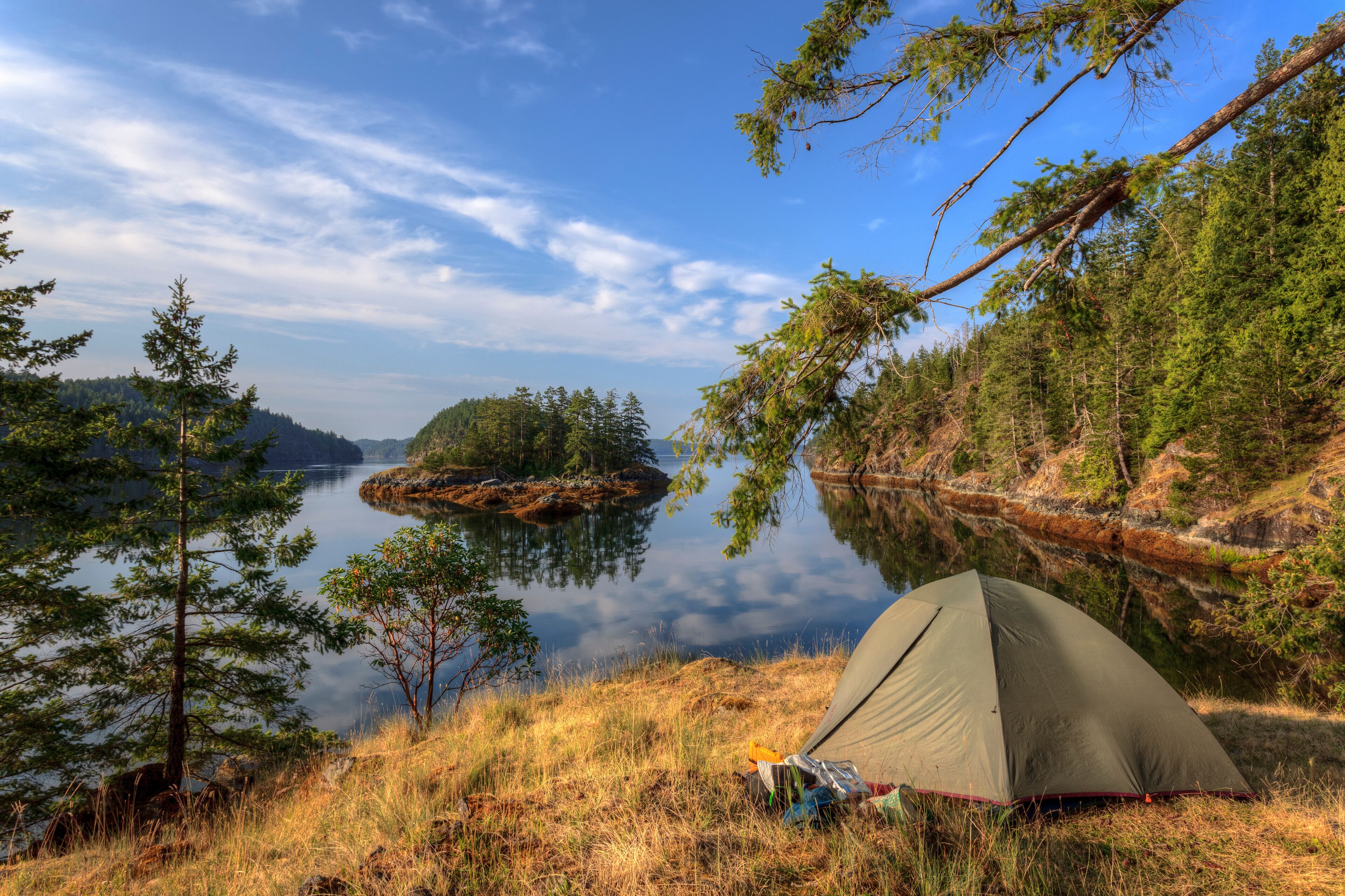 Kayakers camp on Penn Island in Sutil Channel between Read and Cortes Islands British Columbia Canada.