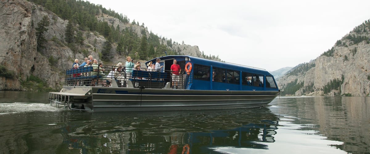 Helena featuring a ferry and a lake or waterhole