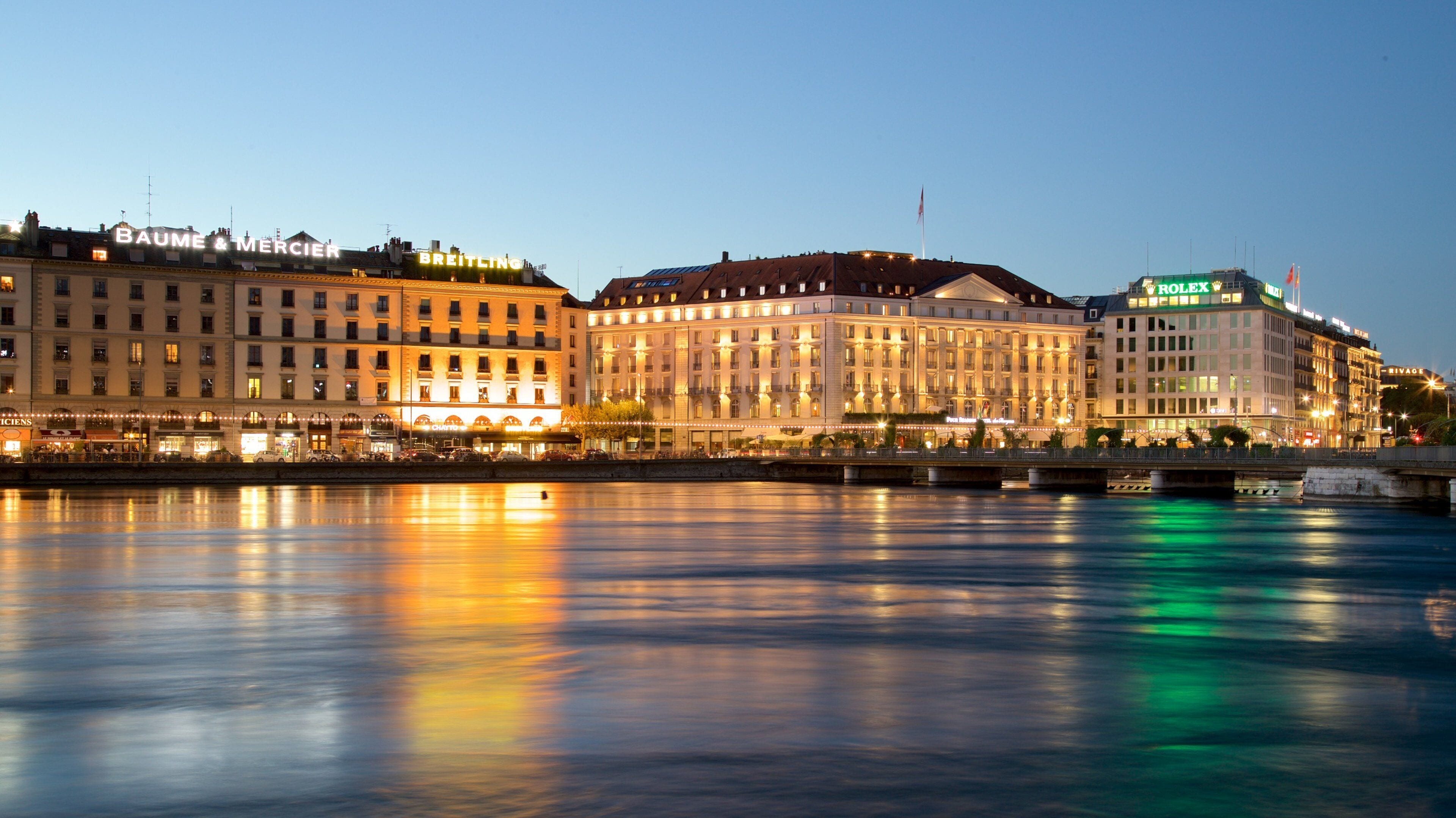 Swiss Plateau showing night scenes, a bay or harbor and a city