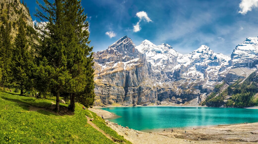 Amazing tourquise Oeschinnensee with waterfalls in Swiss Alps