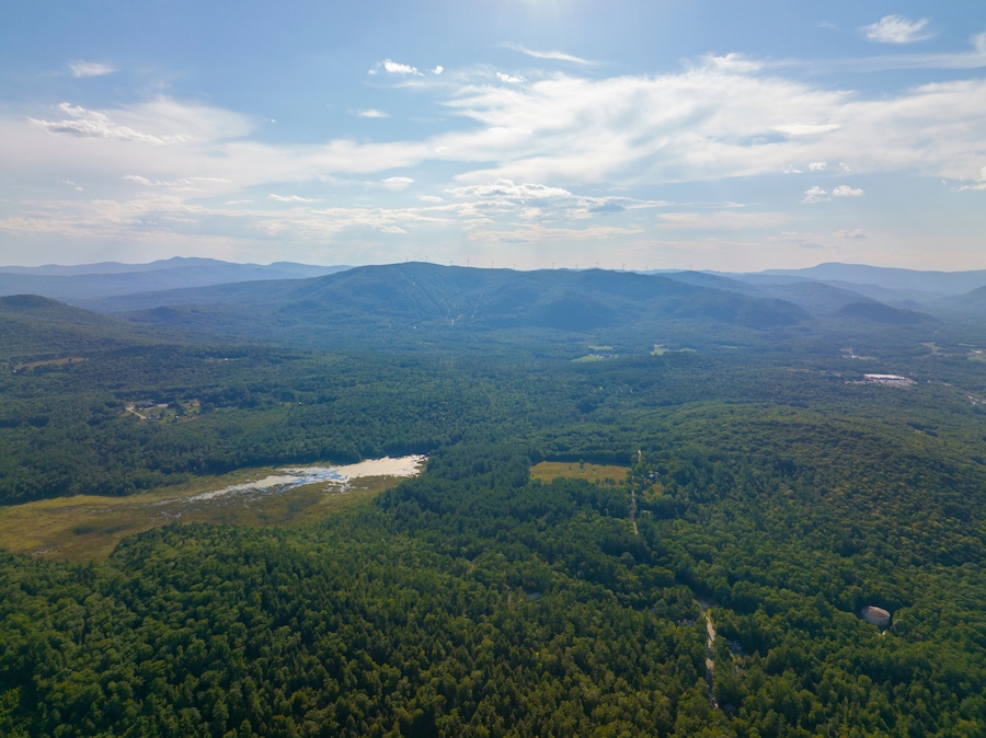 Tenney Mountain aerial view in summer with Groton Wind Power field at the background in Plymouth, New Hampshire NH, USA.