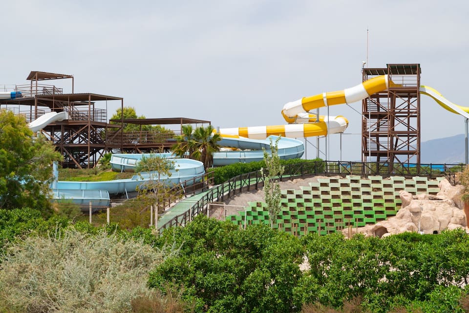 A water park with multiple water slides and a checkered area.