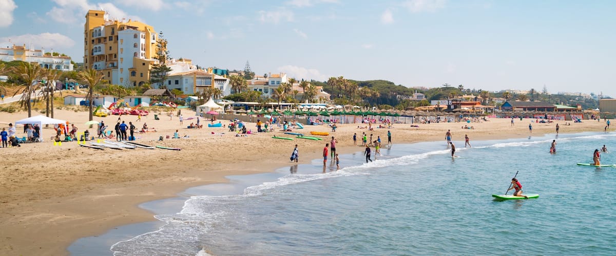 Cabopino Beach showing general coastal views, kayaking or canoeing and a sandy beach