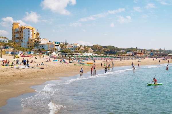 Cabopino Beach showing general coastal views, kayaking or canoeing and a sandy beach
