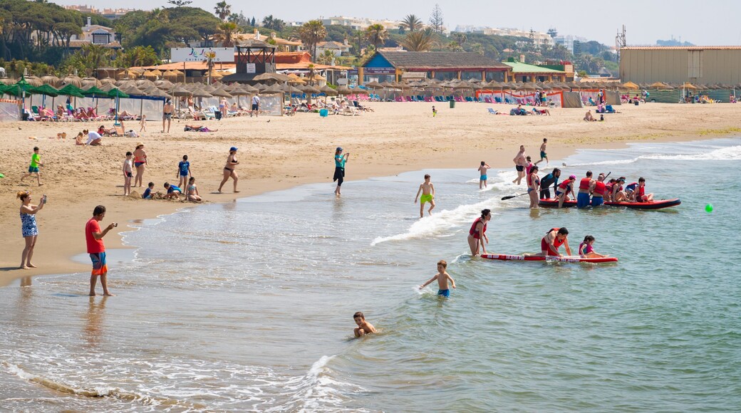 Cabopino Beach which includes a sandy beach, general coastal views and swimming