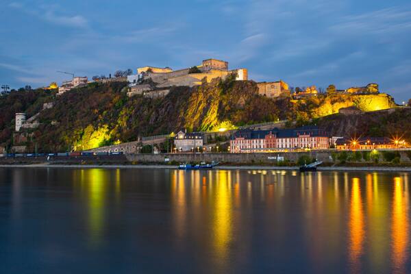 Ehrenbreitstein Fortress showing a small town or village, a river or creek and night scenes