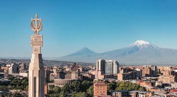 Yerevan cityscape with Mount Ararat. Panorama of the Armenian capital center and mountains. Scenic view from the Cascade monument
