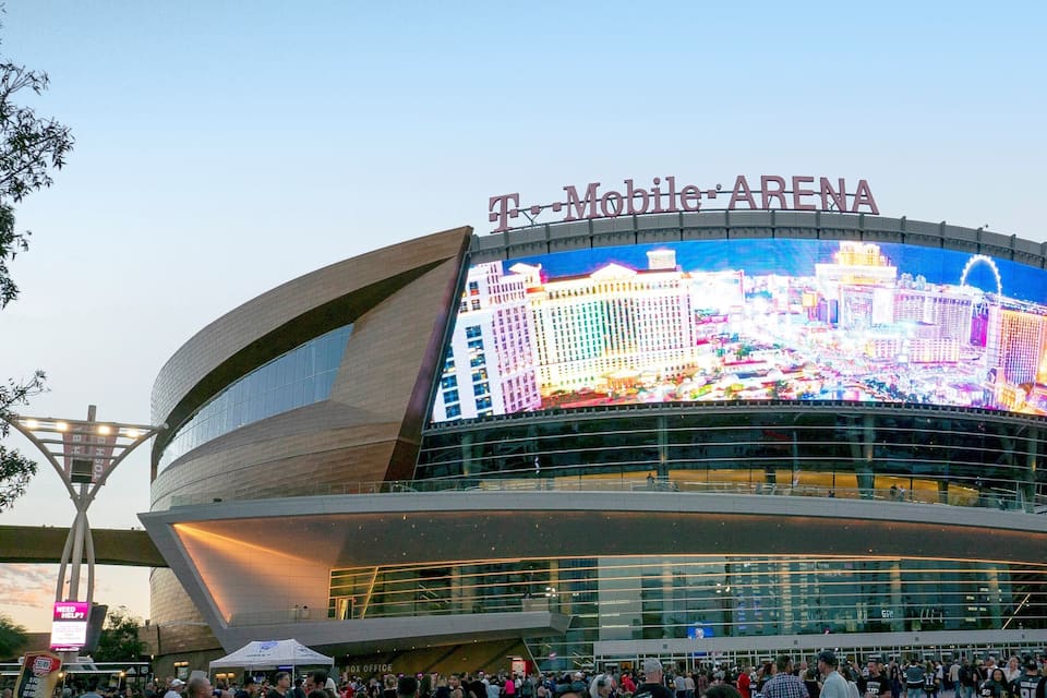 The T-Mobile Arena with a large digital screen displaying a cityscape.