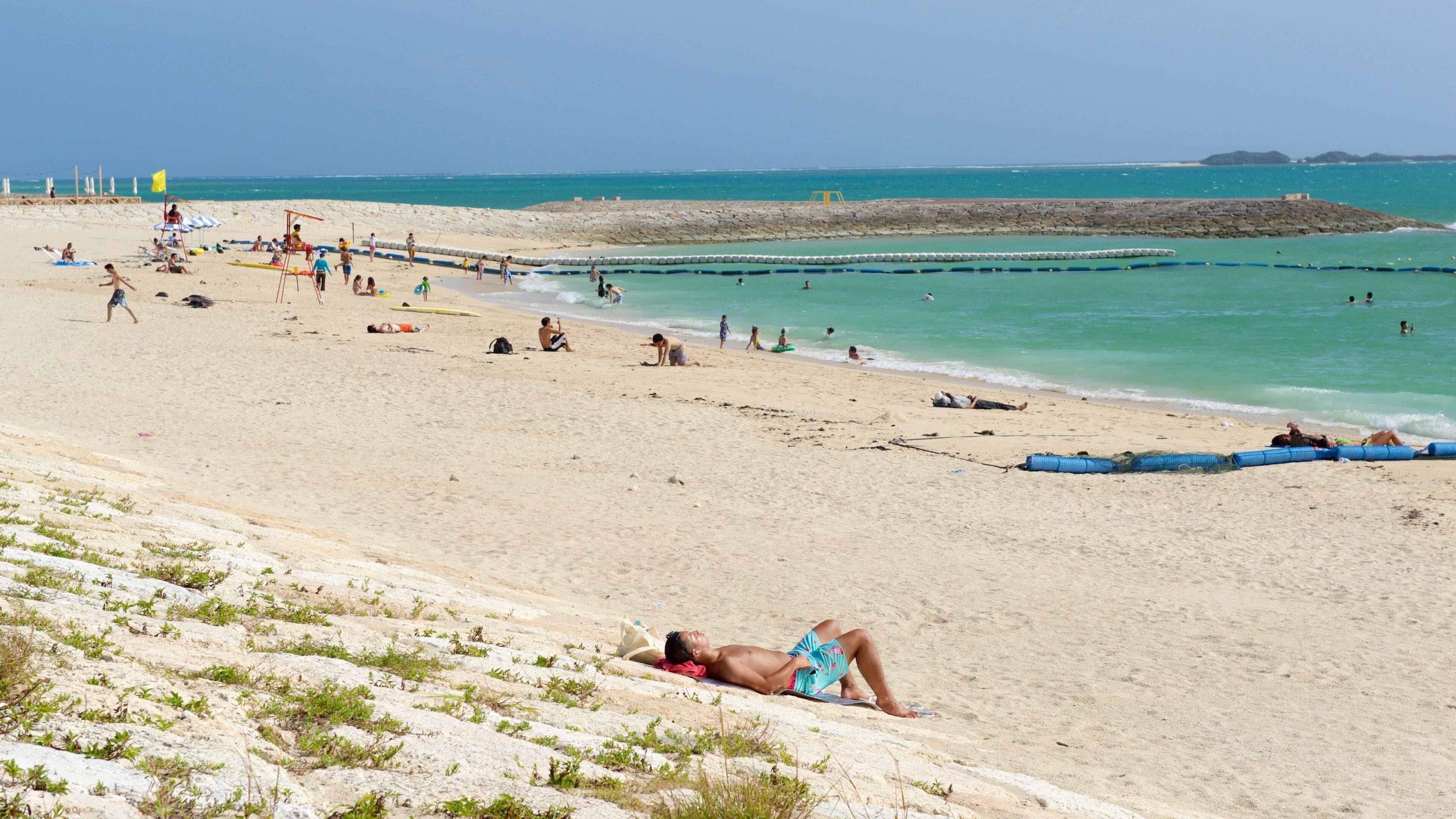 Toyosaki Chura Sun Beach which includes swimming, a sandy beach and general coastal views