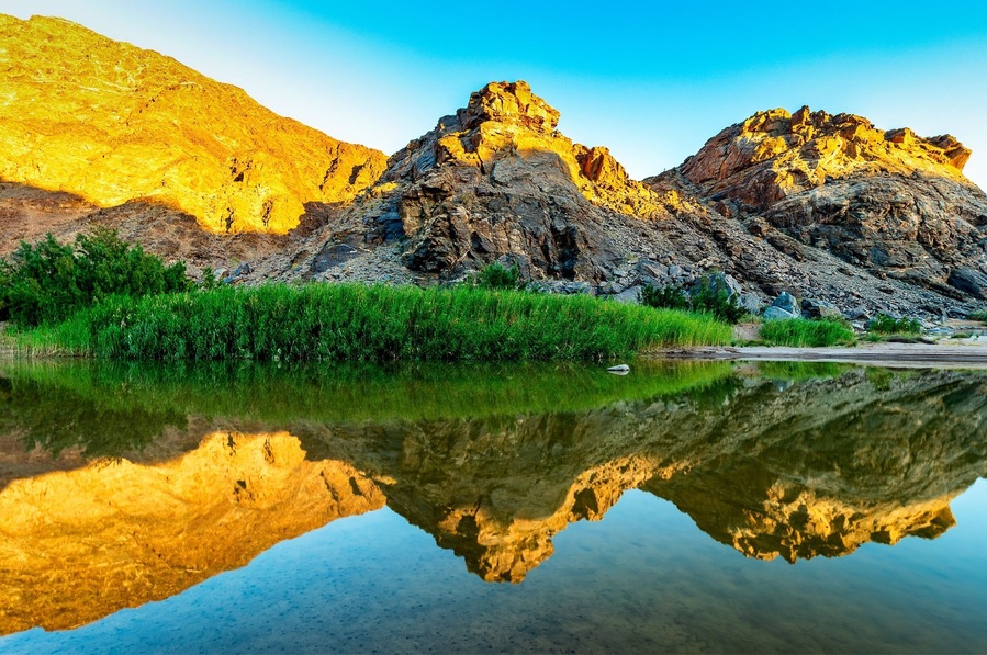 An amazing campsite set on the Fish River.  Get up early and walk down the river, depending on the time of year it will have different levels of water but their is a path. As the sun rises and lights up the mountains on the west side of the valley, there are some amazing reflections.  A beauty to behold. #GreatOutdoors