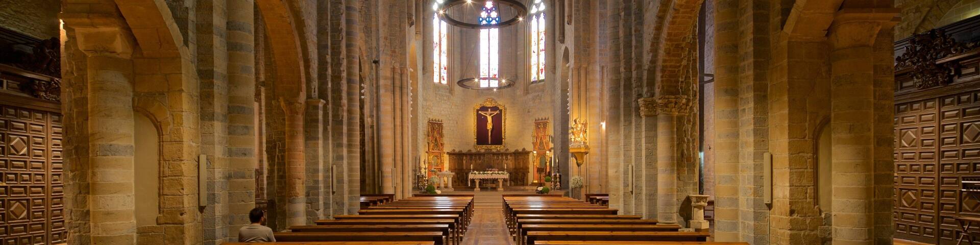 Iglesia de San Nicolas featuring a church or cathedral, heritage elements and interior views