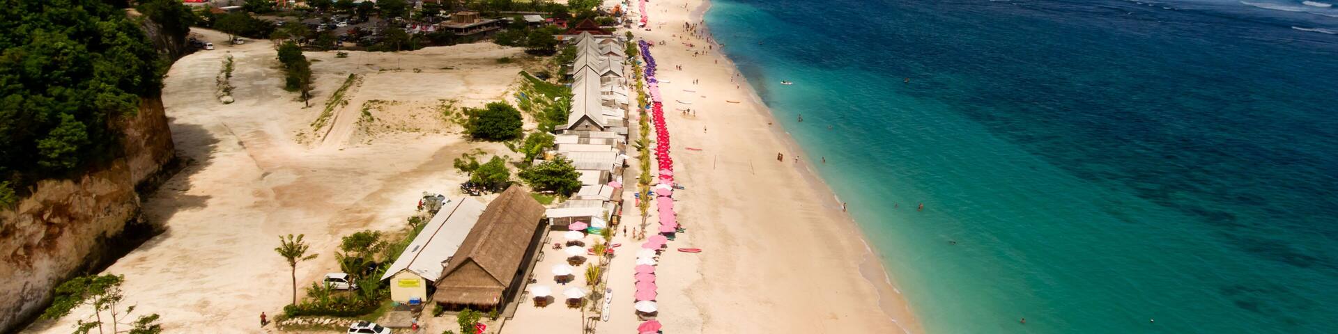 Top view of a Pandawa beach with many umbrellas and people relaxing. Bali, Indonesia.; Shutterstock ID 580345174; Purchase Order: -