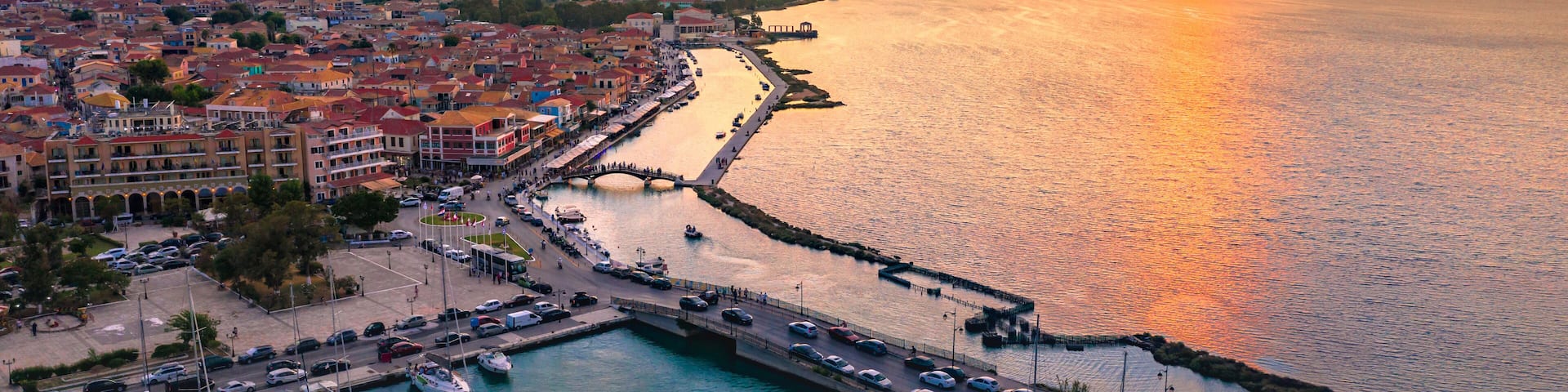 Lefkas (Lefkada) town, amazing view at the small marina for the fishing boats with the nice wooden bridge and promenade, Ionian island, Greece