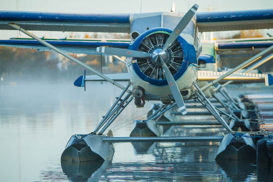 A hydrofoil boat with a propeller and a blue and white color scheme.