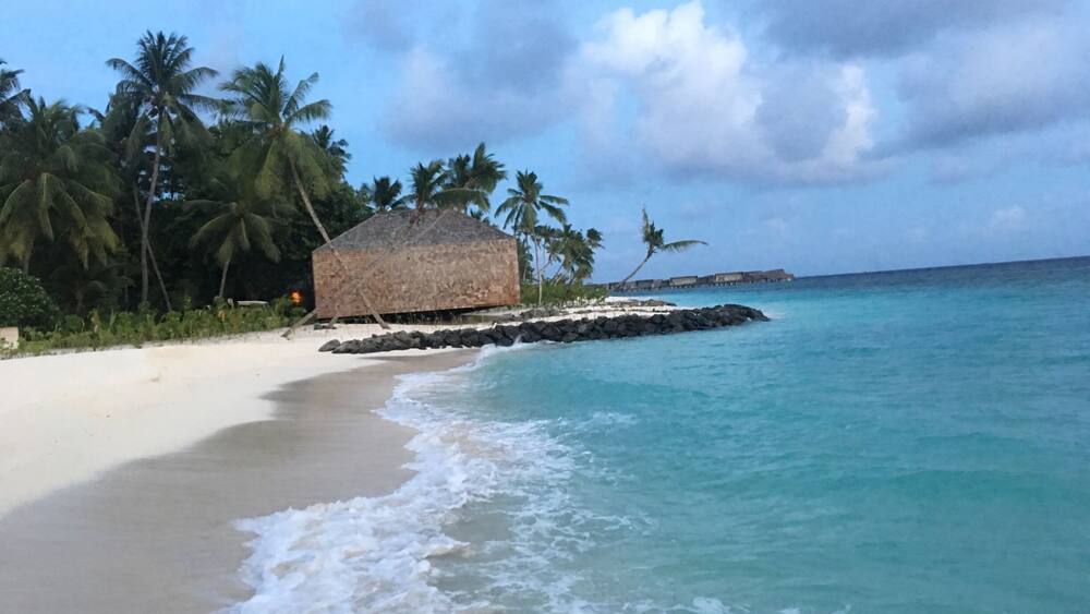 The St. Regis Maldives Vommuli Resort is ideally poised on its own exclusive island in the Republic of Maldives. Set on nine hectares in the Dhaalu Atoll, the resort is surrounded by pristine landscapes, thick tropical vegetation, a fine white-sand beach, a brackish lagoon, and the glistening turquoise Indian Ocean. Male' International Airport can be reached by seaplane in 45 minutes.