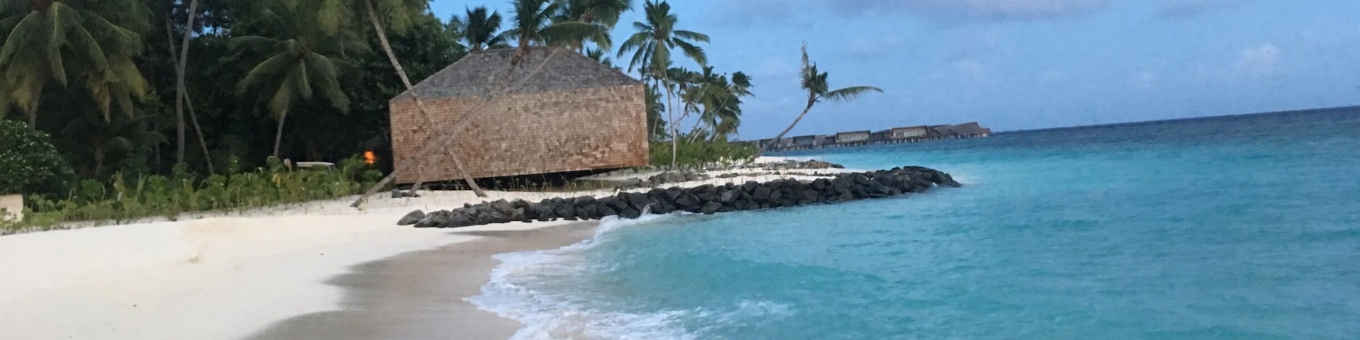 The St. Regis Maldives Vommuli Resort is ideally poised on its own exclusive island in the Republic of Maldives. Set on nine hectares in the Dhaalu Atoll, the resort is surrounded by pristine landscapes, thick tropical vegetation, a fine white-sand beach, a brackish lagoon, and the glistening turquoise Indian Ocean. Male' International Airport can be reached by seaplane in 45 minutes.