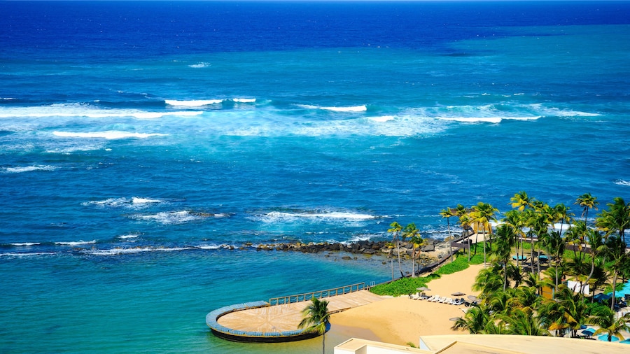 Tropical seascape aerial landscape in San Juan, Puerto Rico over La Poza del Escambrón Beach and Escambron Beach