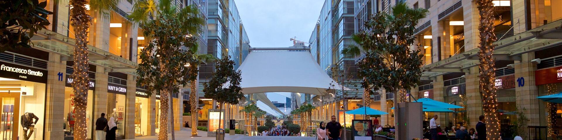 Al Abdali Mall showing street scenes as well as a couple