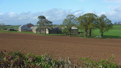 Lonning Head, Sebergham The view across a ploughed arable field from the B5305 which has climbed out of the Caldew valley.