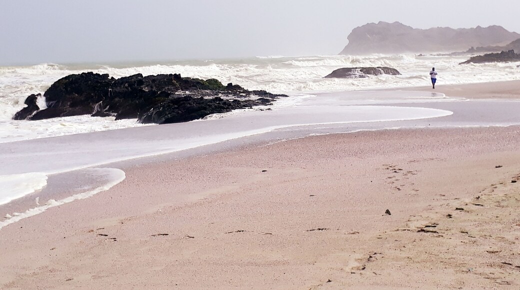 A serene Beach and a Lone Tourist....Enjoying the Breeze