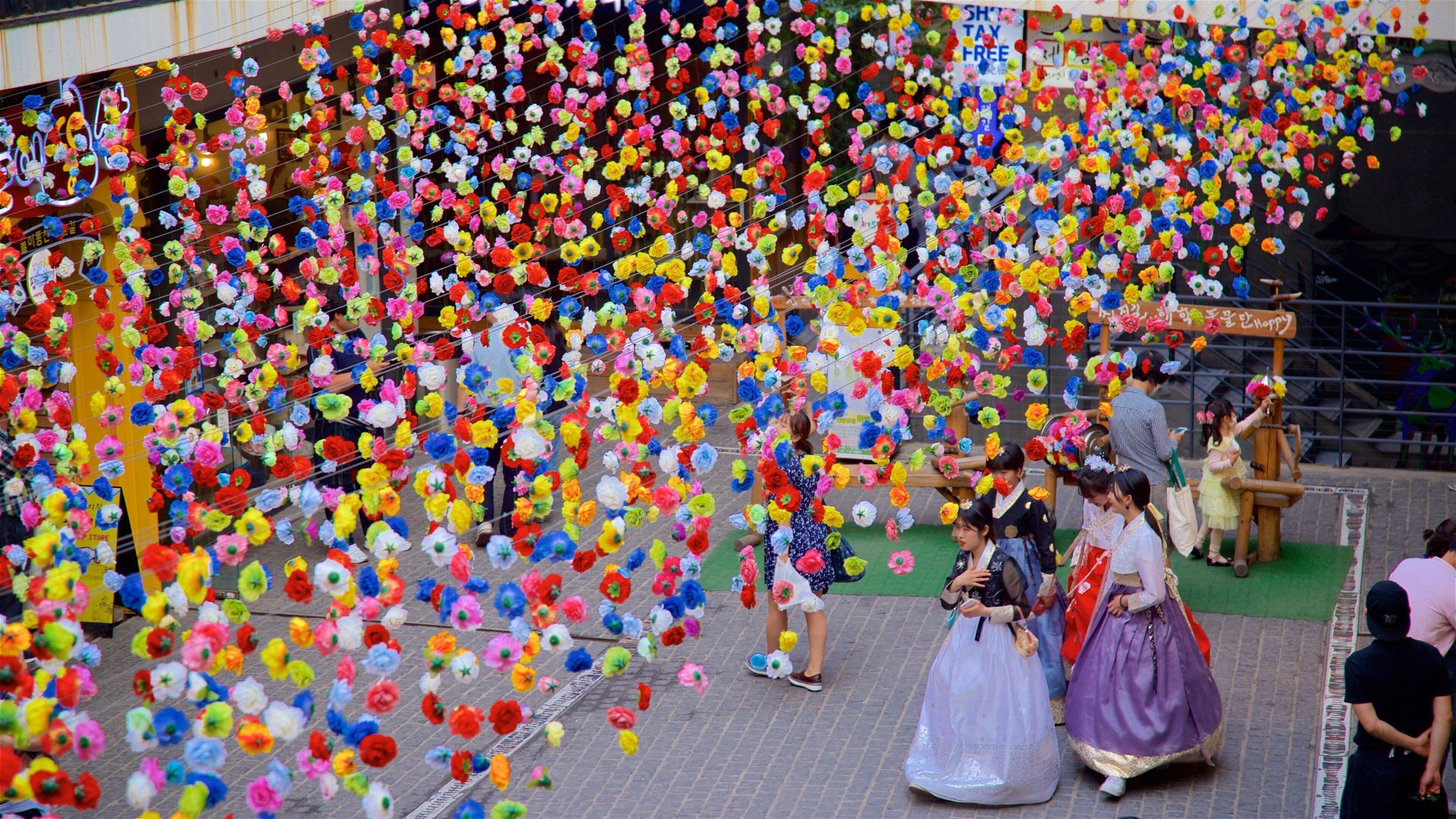 Insadong which includes outdoor art as well as a small group of people