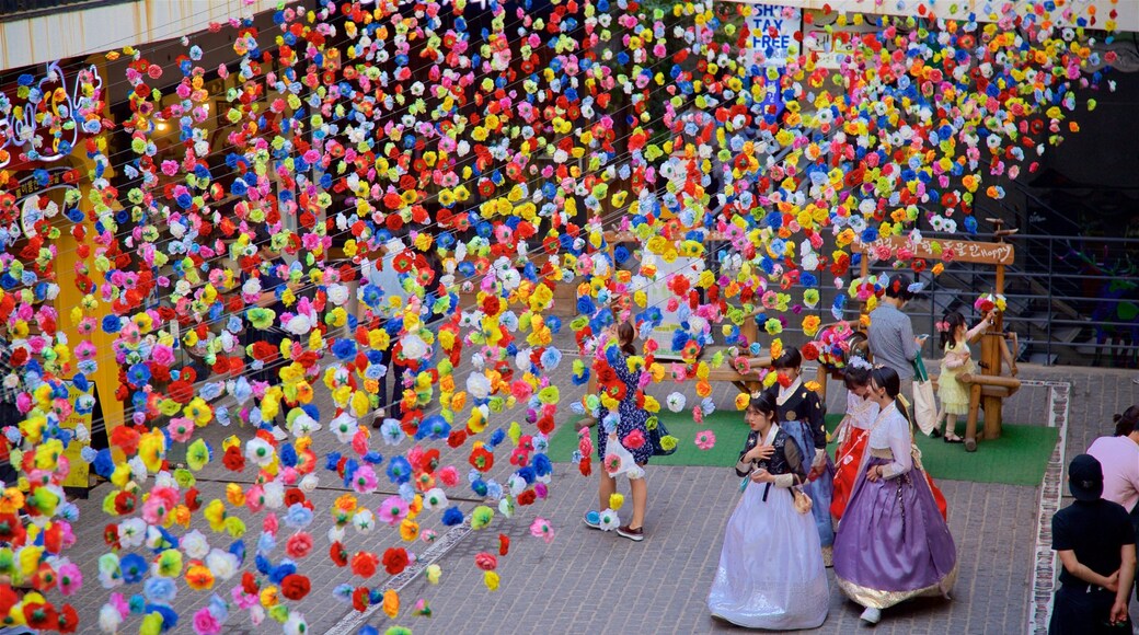 Insadong which includes outdoor art as well as a small group of people