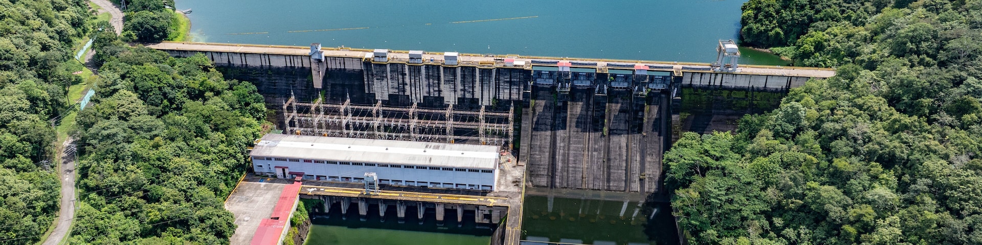 aerial landscape view of area around Bayano Dam and River "Rio Chepo" with bridge and Hydroelectric Power Plant surrounded by Rainforest, located in Vacamonte at Bayano Lake, Panama