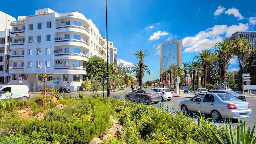 Road traffic and main street named Habiba Bourguiba with modern architecture. Tunis, Tunisia