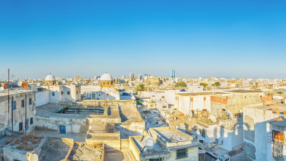 The aerial view of Tunis Medina with the high minaret of the Great Mosque, Tunisia.