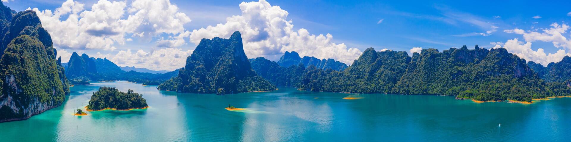 Panorama view of mountain and blue sky with cloud in Khao Sok National park locate in Ratchaprapha dam in Surat Thani province, Thailand.