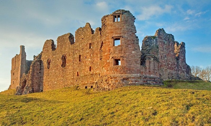Brough Castle, near to Brough, Cumbria, Great Britain. Sun setting on the remains of Brough Castle