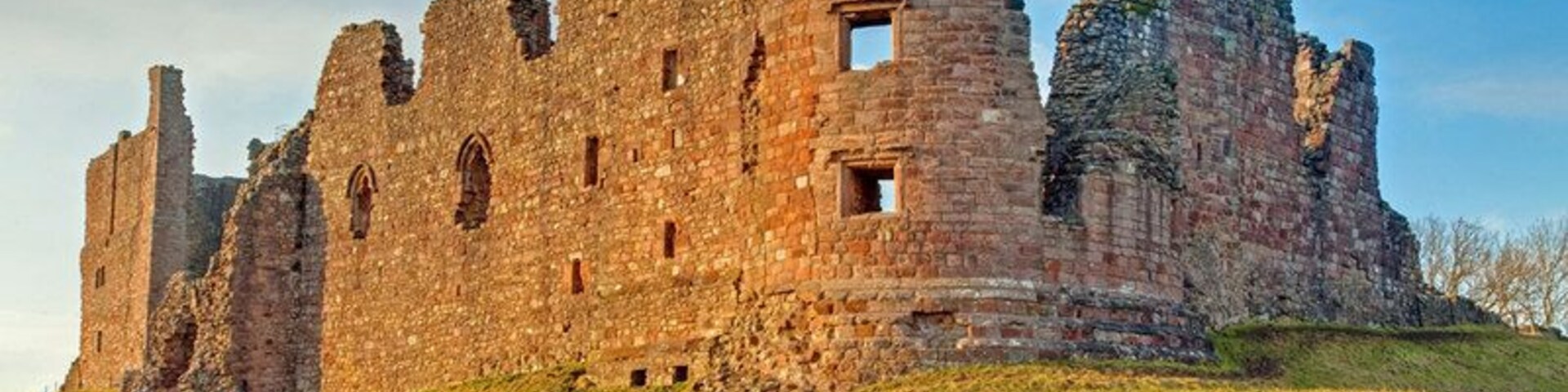 Brough Castle, near to Brough, Cumbria, Great Britain. Sun setting on the remains of Brough Castle