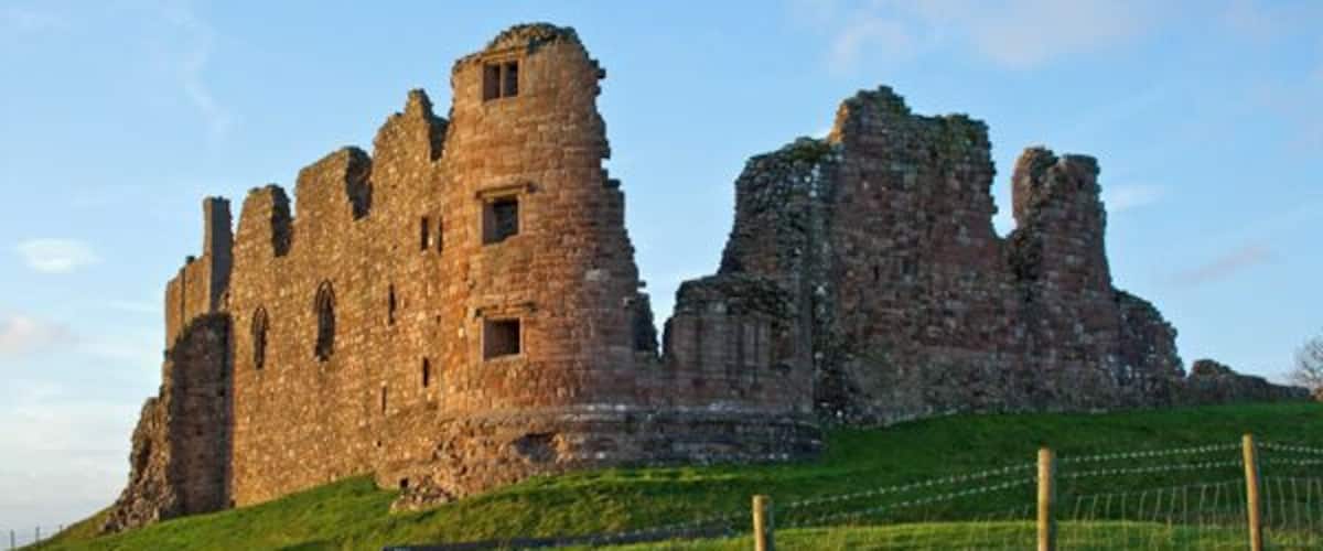 Brough Castle, near to Brough, Cumbria, Great Britain. The photograph was taken late afternoon as the sun was setting and hence the wonderful glow achieved on the tower.