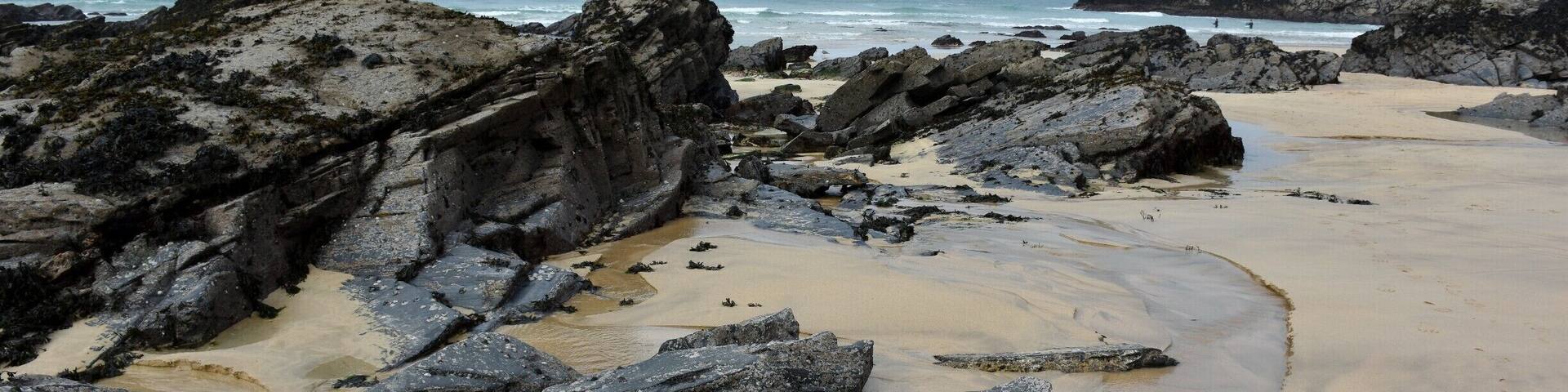 Trevone Bay beach, Padstow, North Cornwall is located to the south of Trevose Head and to the north of Harlyn Bay. one of only eight beaches that have received the award in Cornwall.
This gently shelving, sandy beach is surrounded by cliffs and situated in an area of great geological interest
The beach has golden sand and little alcoves to sit and watch away the day
The cliffs to the north east of the beach provide fantastic walks and views to Hawkers Cove, the Camel Estuary and beyond. The cliff has a large blowhole as well, which appears on top of the cliff, so beware of getting too close to the edge if you're not good with heights