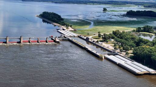 Panorama of Locks and Dam 13 on the Mississippi river at Fulton, IL loading the lock so a barge can proceed down river.