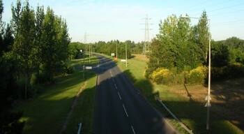 Road - Two Mile Ash Taken from a bridge between the two halves of the golf course. Two Mile Ash is left and behind, Kiln Farm ahead to the right.