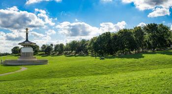 Panorama of Lakeside Willen Park with Peace Pagoda Temple at sunny summer day in Milton Keynes, England