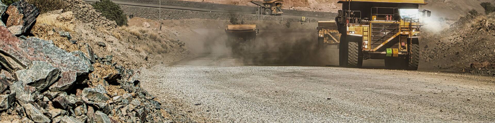 Open Pit Diamond Mining And Equipment , giant trucks on the gravel roads,