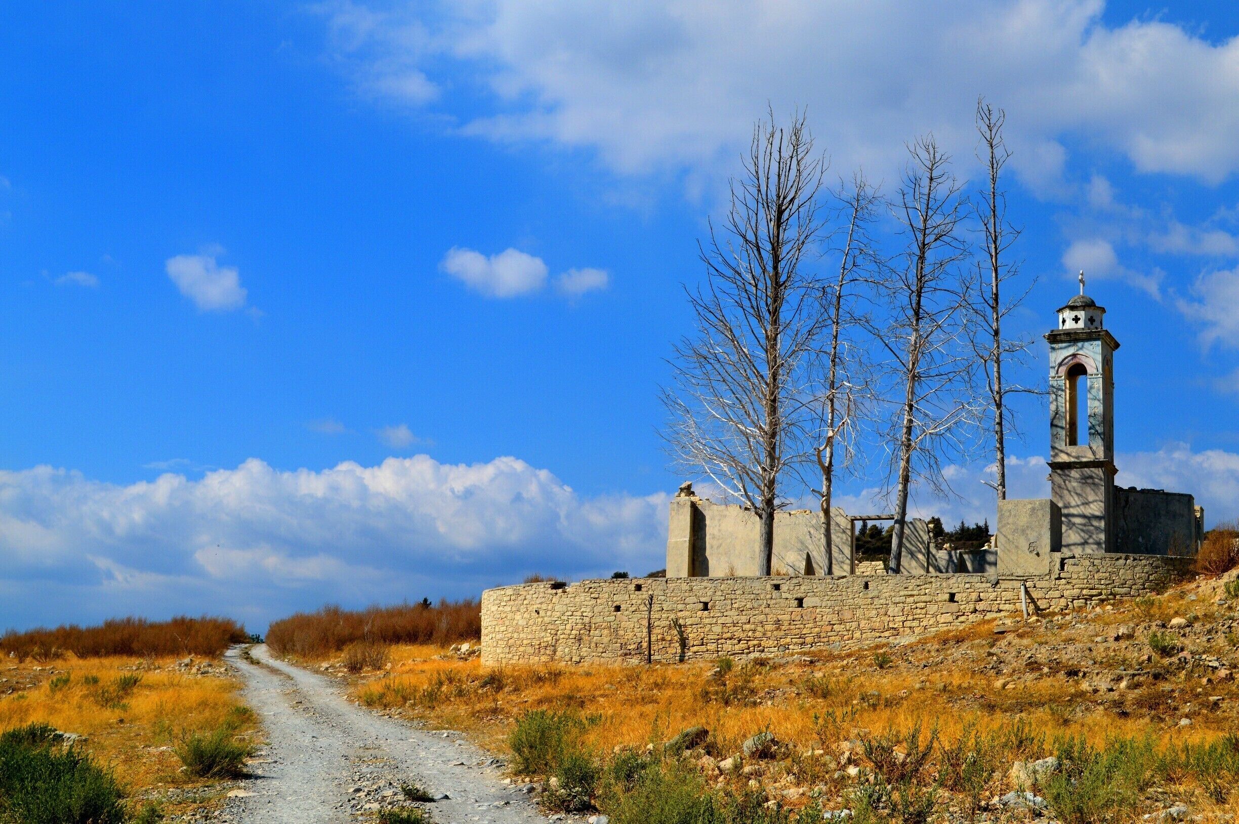 Abandoned church of St. Nicholas, which becomes largely submerged when the Kouris Dam fills up. The church was inside the old village of Alassa. When the dam was being built in 1980s, a new Alassa village was constructed at a higher elevation and the old village was abandoned. #Blue #BestOf5