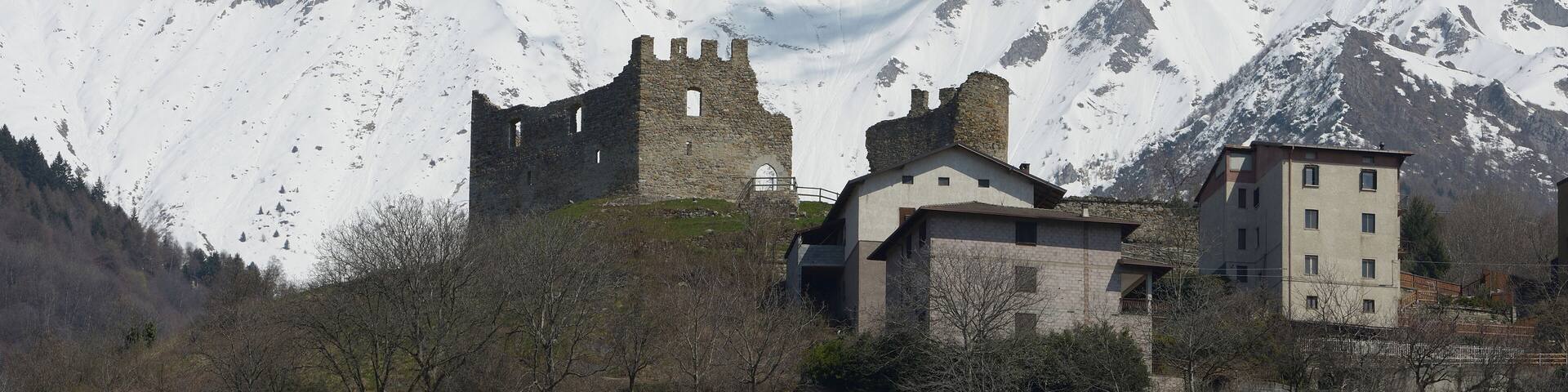 The castle ruin of Cimbergo and Monte Tredenus 2796 m in Valcamonica Italy