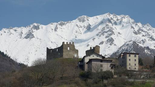 The castle ruin of Cimbergo and Monte Tredenus 2796 m in Valcamonica Italy
