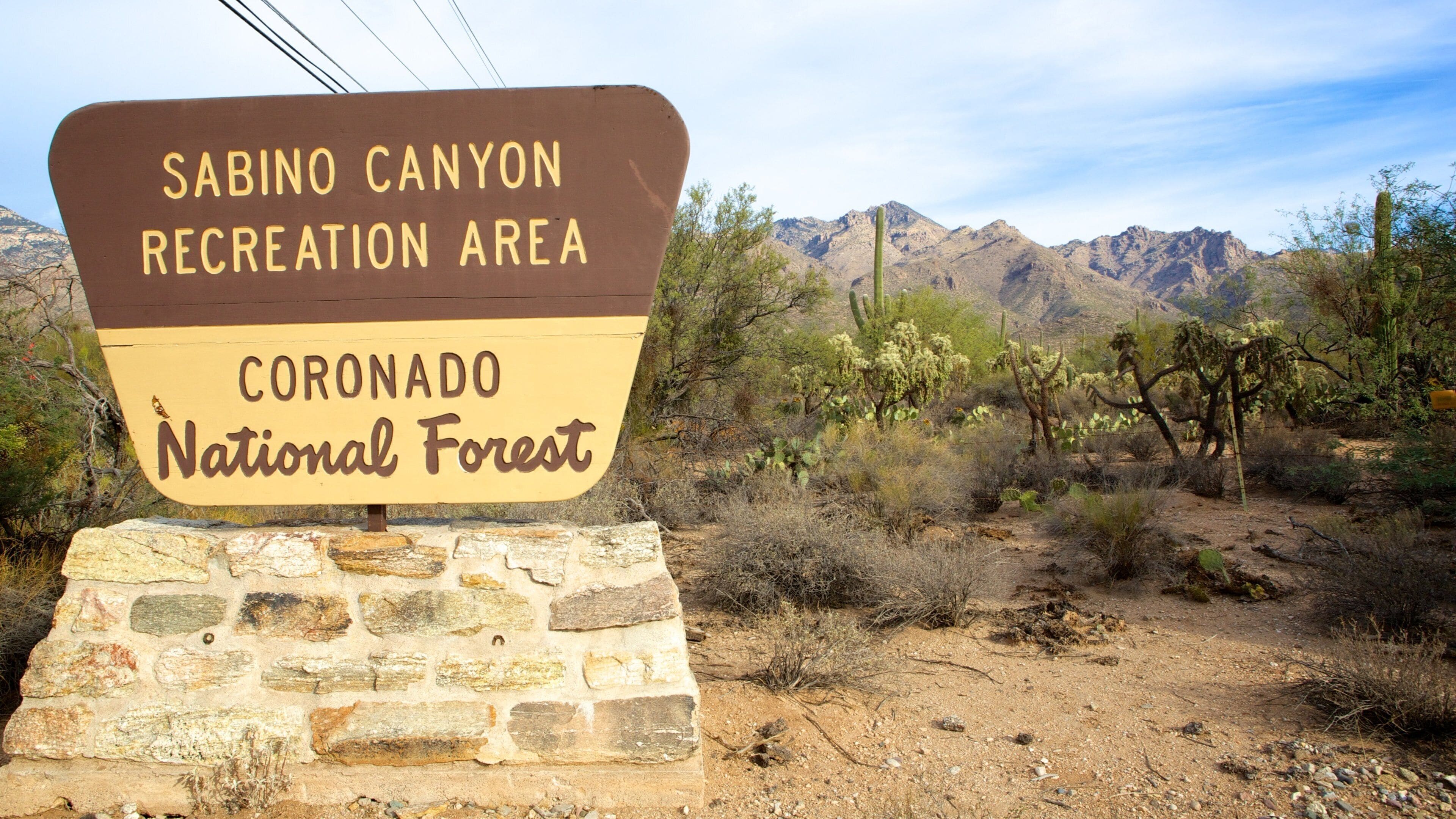 A sign for the Sabino Canyon Recreation Area in the Coronado National Forest.